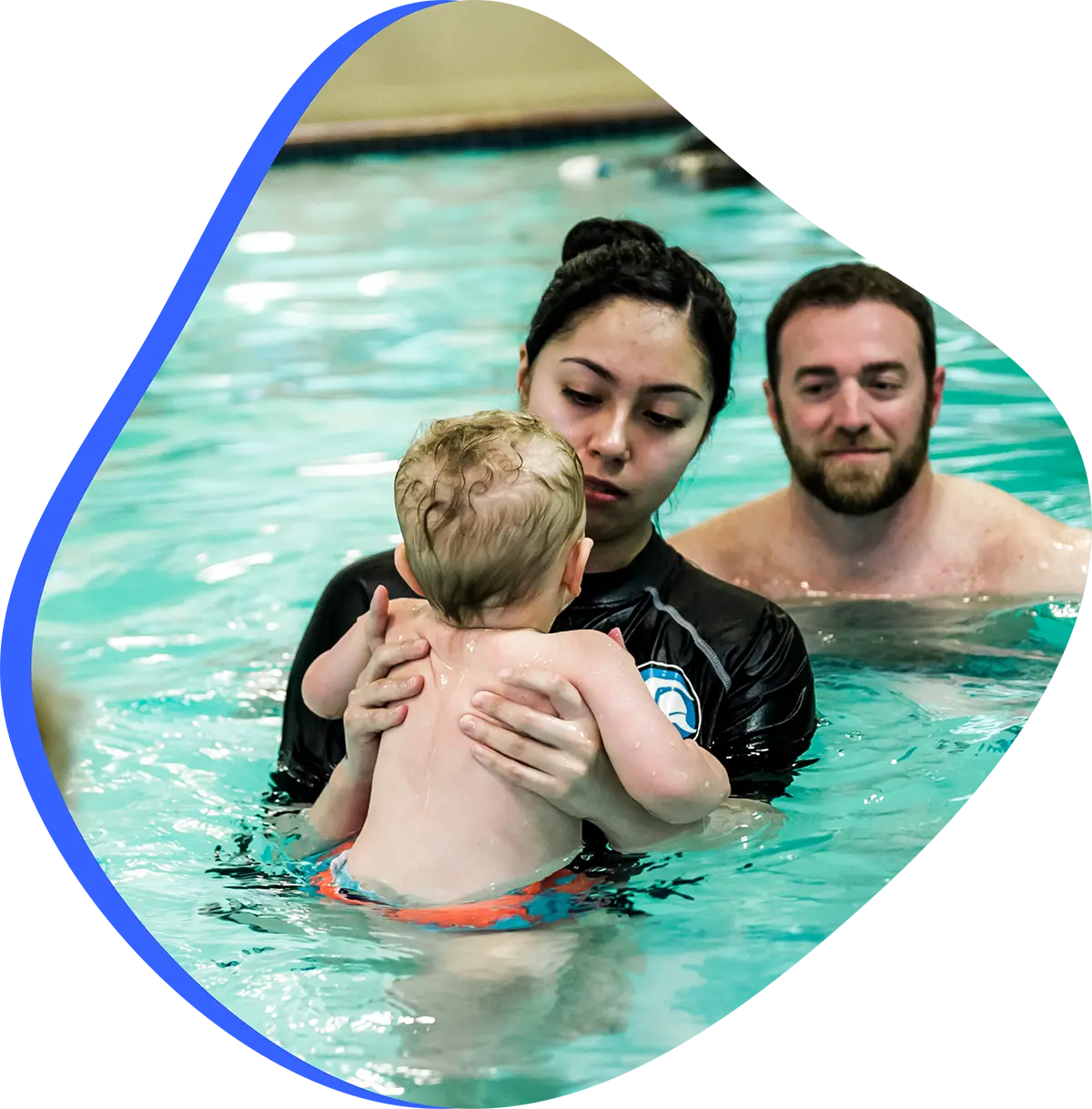Family exploring swim classes for every age and skill level at FINS Swim School.