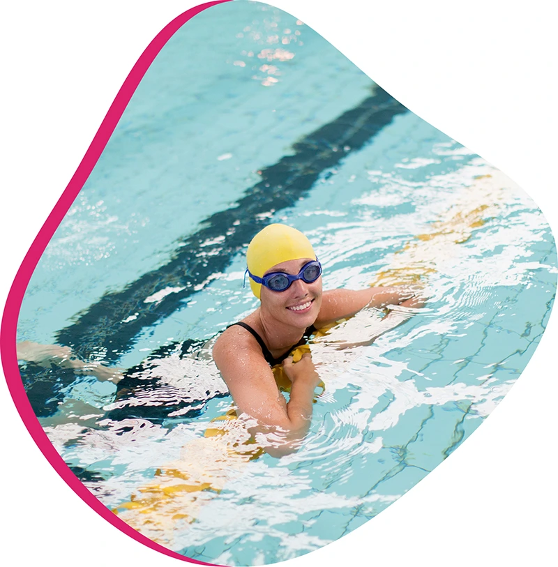 An adult swimmer receiving personalized one-on-one coaching from a FINS instructor in Atascocita.