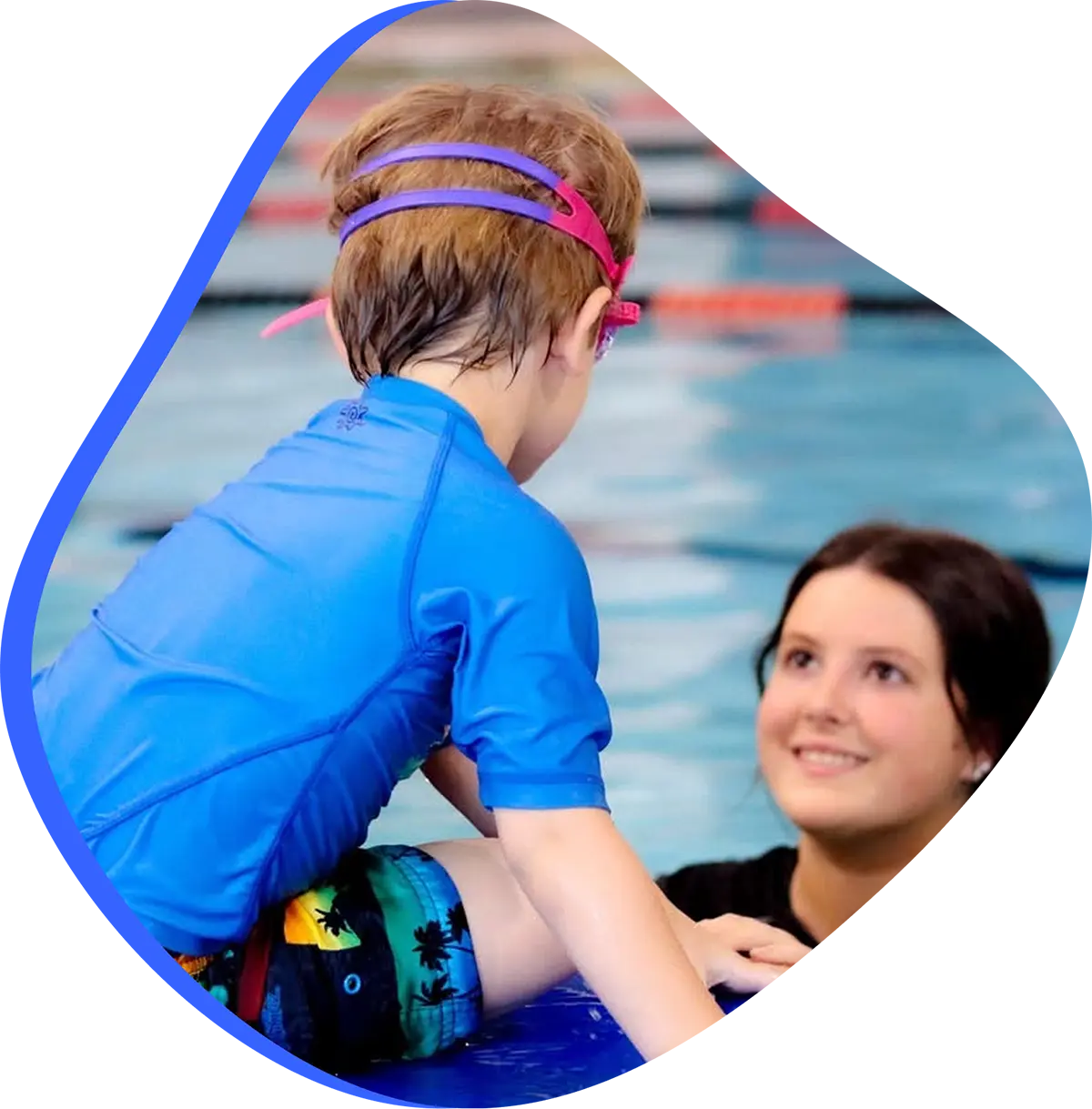 Family exploring swim classes for every age and skill level at FINS Swim School.