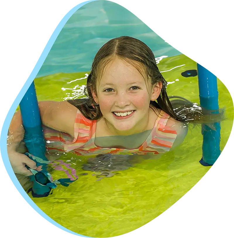 An adult swimmer receiving personalized one-on-one coaching from a FINS instructor in Atascocita.