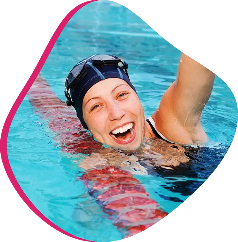 An adult swimmer receiving personalized one-on-one coaching from a FINS instructor in Atascocita.