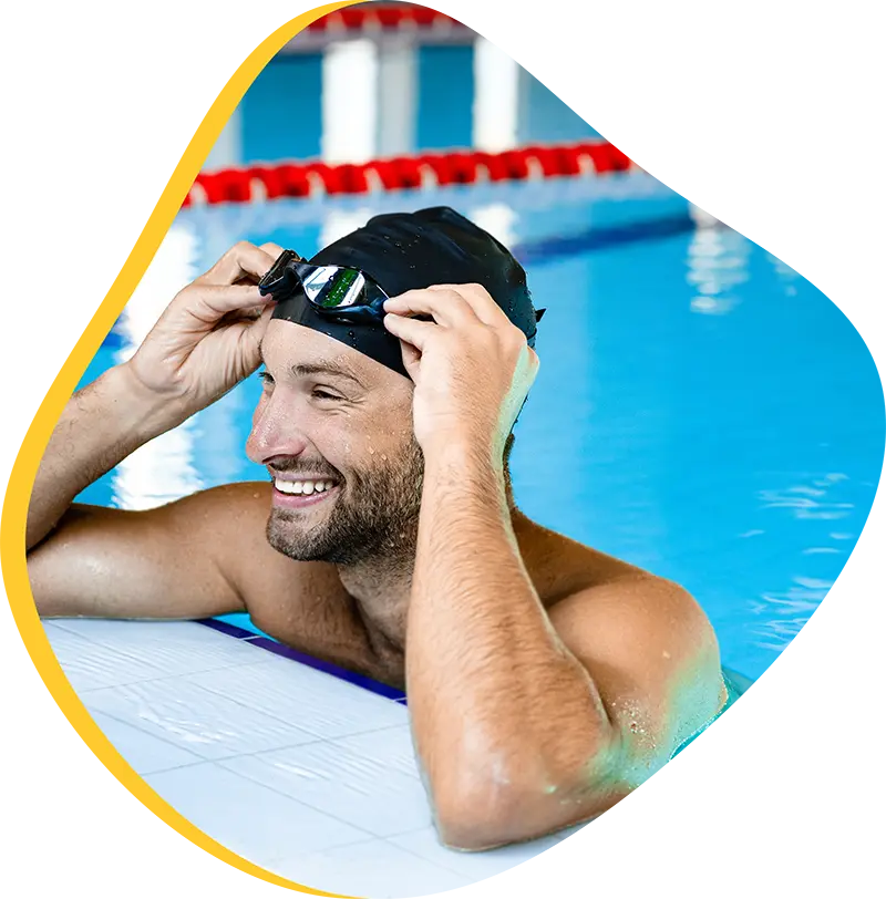 An adult swimmer receiving personalized one-on-one coaching from a FINS instructor in Atascocita.