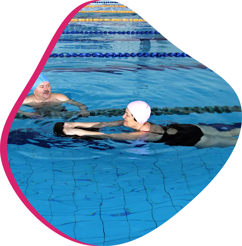 An adult swimmer receiving personalized one-on-one coaching from a FINS instructor in The Woodlands.